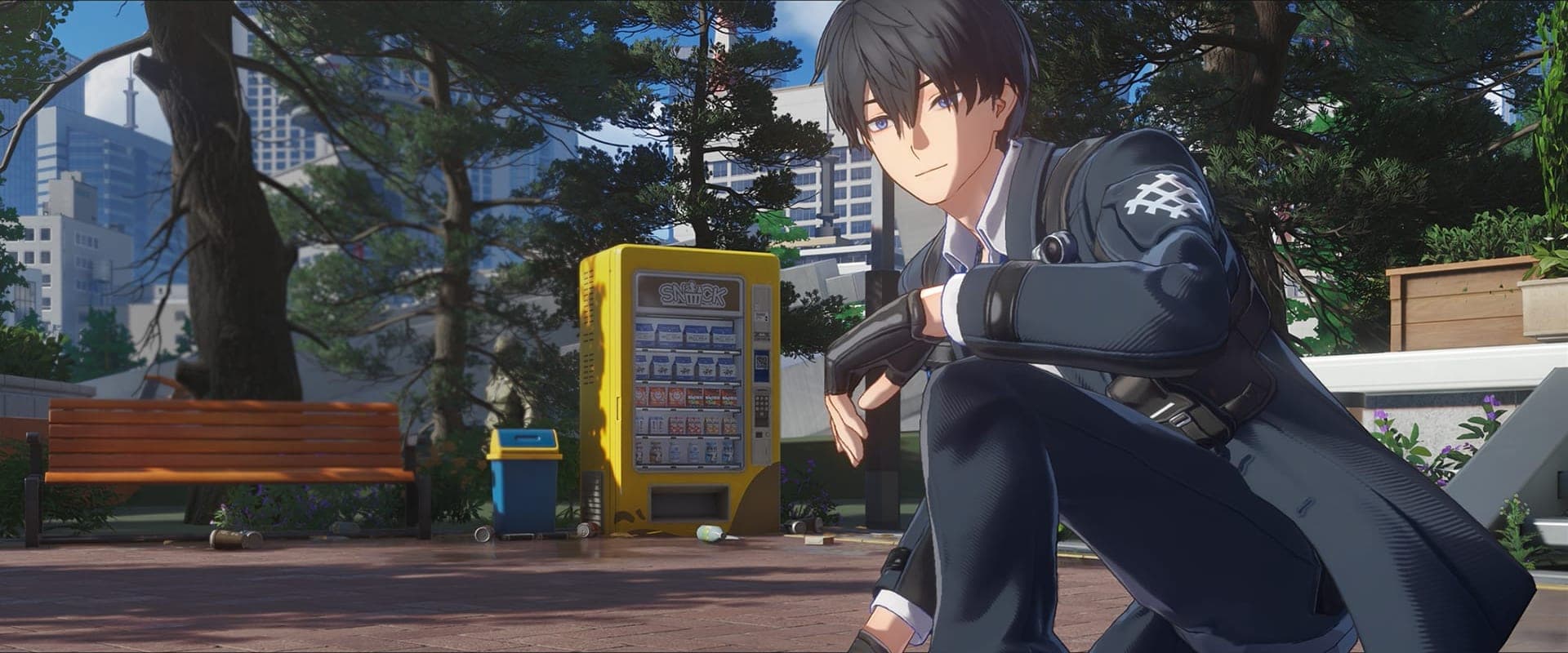 The Captain, a dark-haired young man in a dark coat and fingerless gloves, crouching in a park next to a yellow vending machine