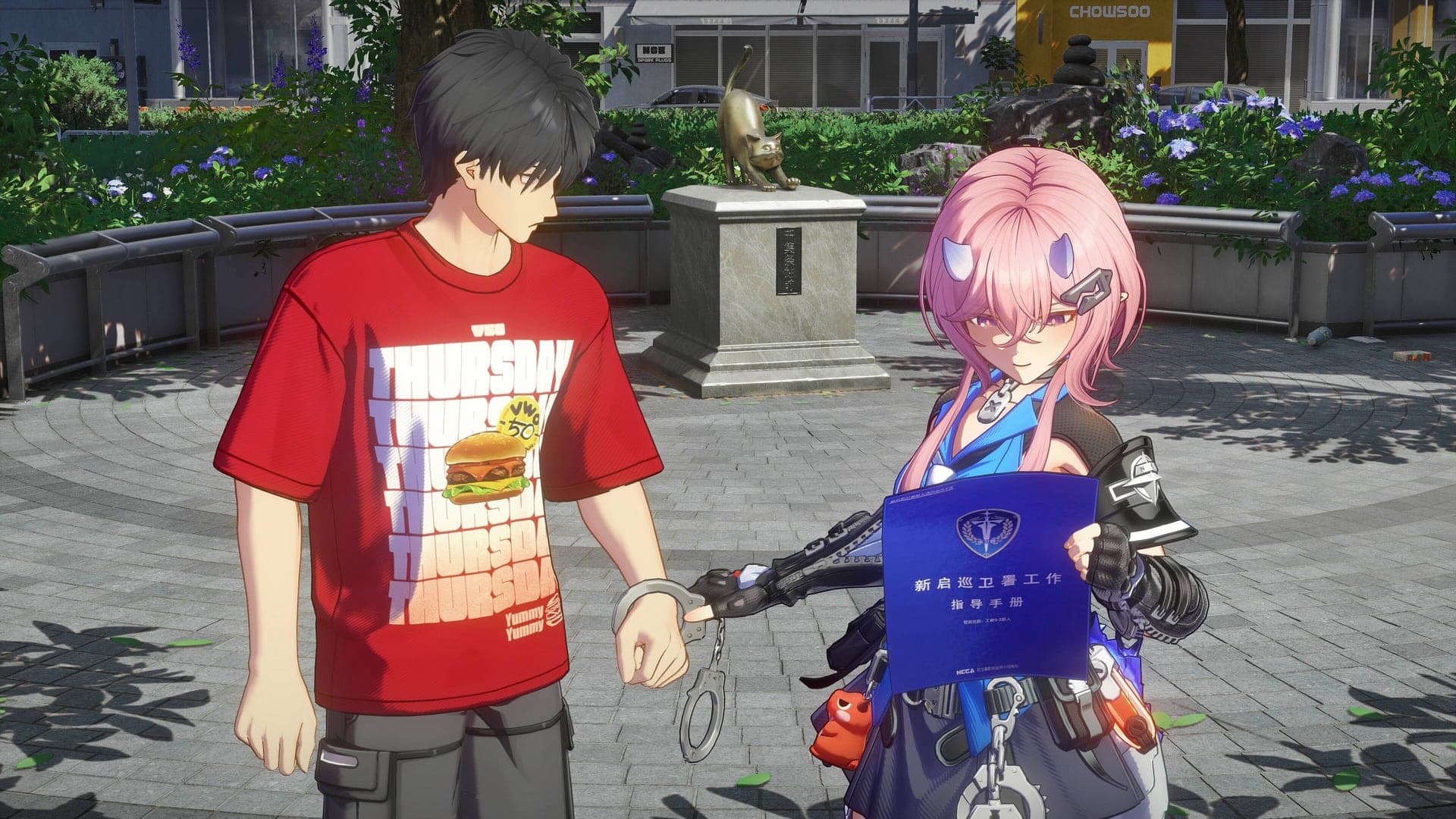 Richie holding up a blue NCCA folder next to a man in a red T-shirt who is handcuffed, on a city square